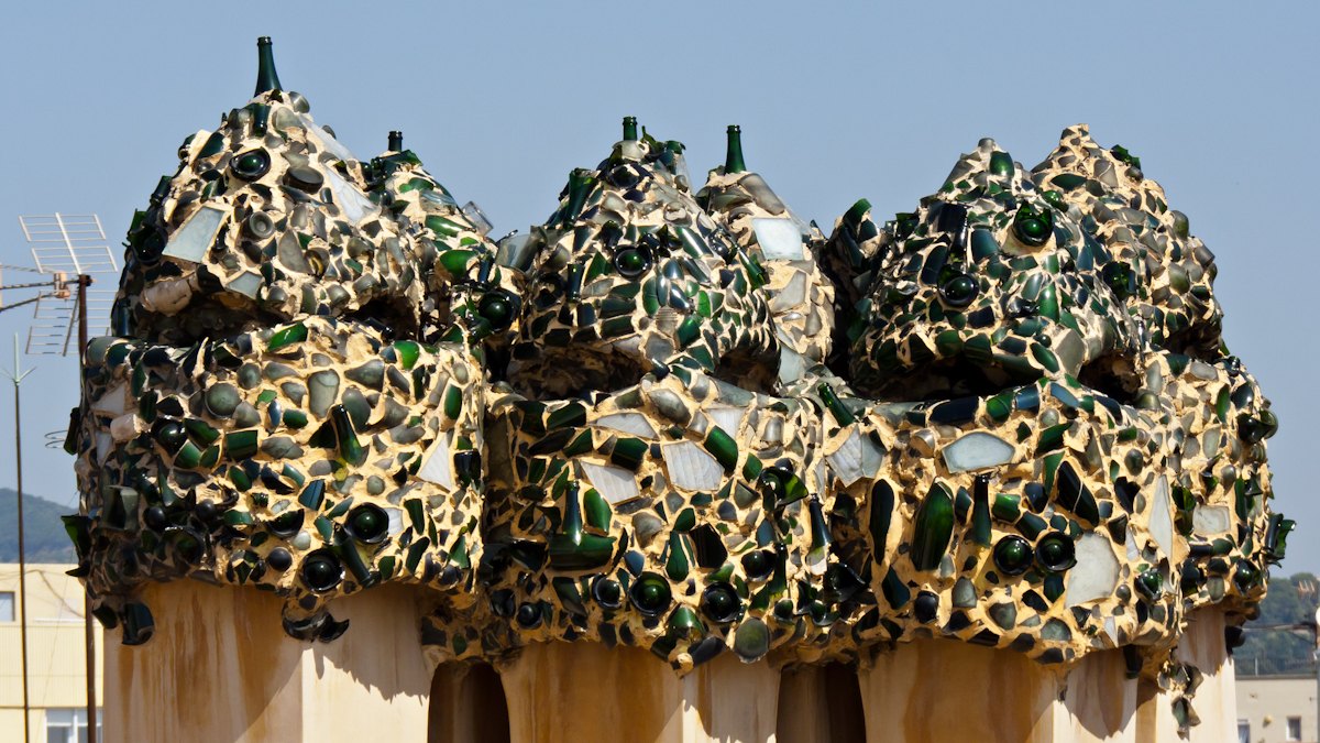 Chimneys at Casa Milà covered in fragments of green and white glass.