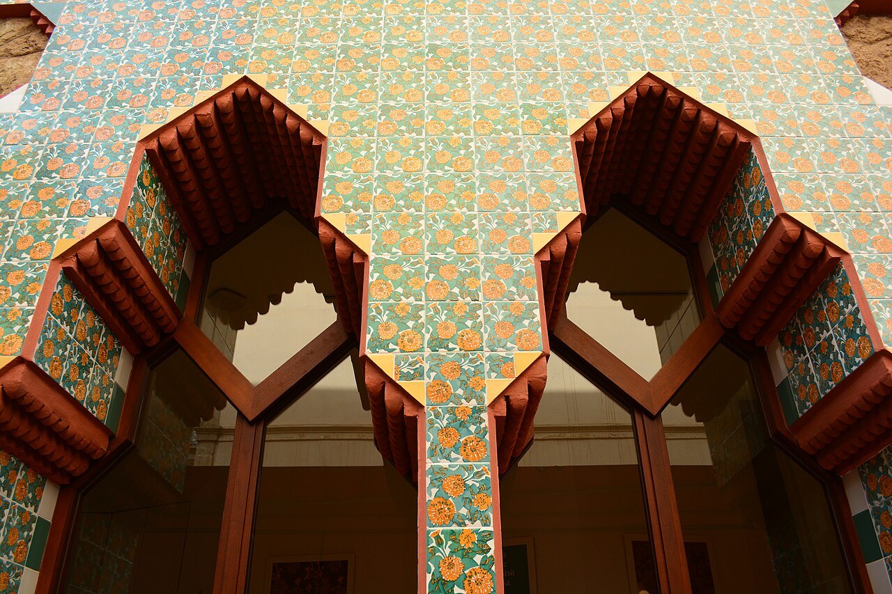Stepped, arched window recesses at Casa Vicens, set in a wall of patterned tile.