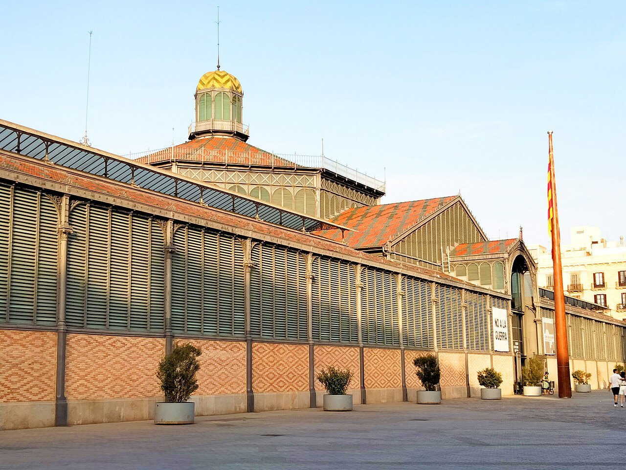 The side wall of the Born market, with its brick base and slatted upper walls.