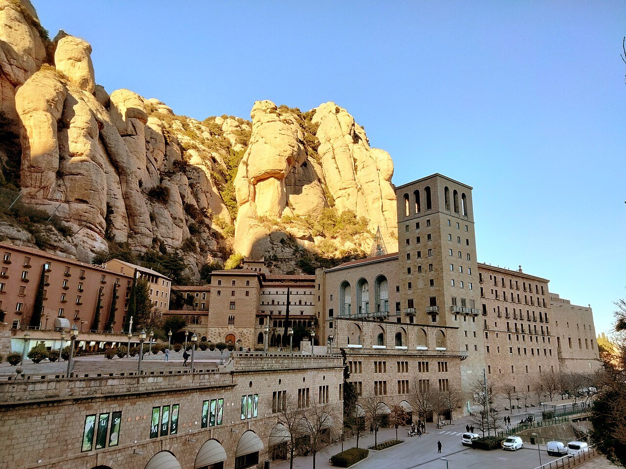 The monastery buildings beneath the rock pinnacles of Montserrat, seen from the Sant Miquel path.