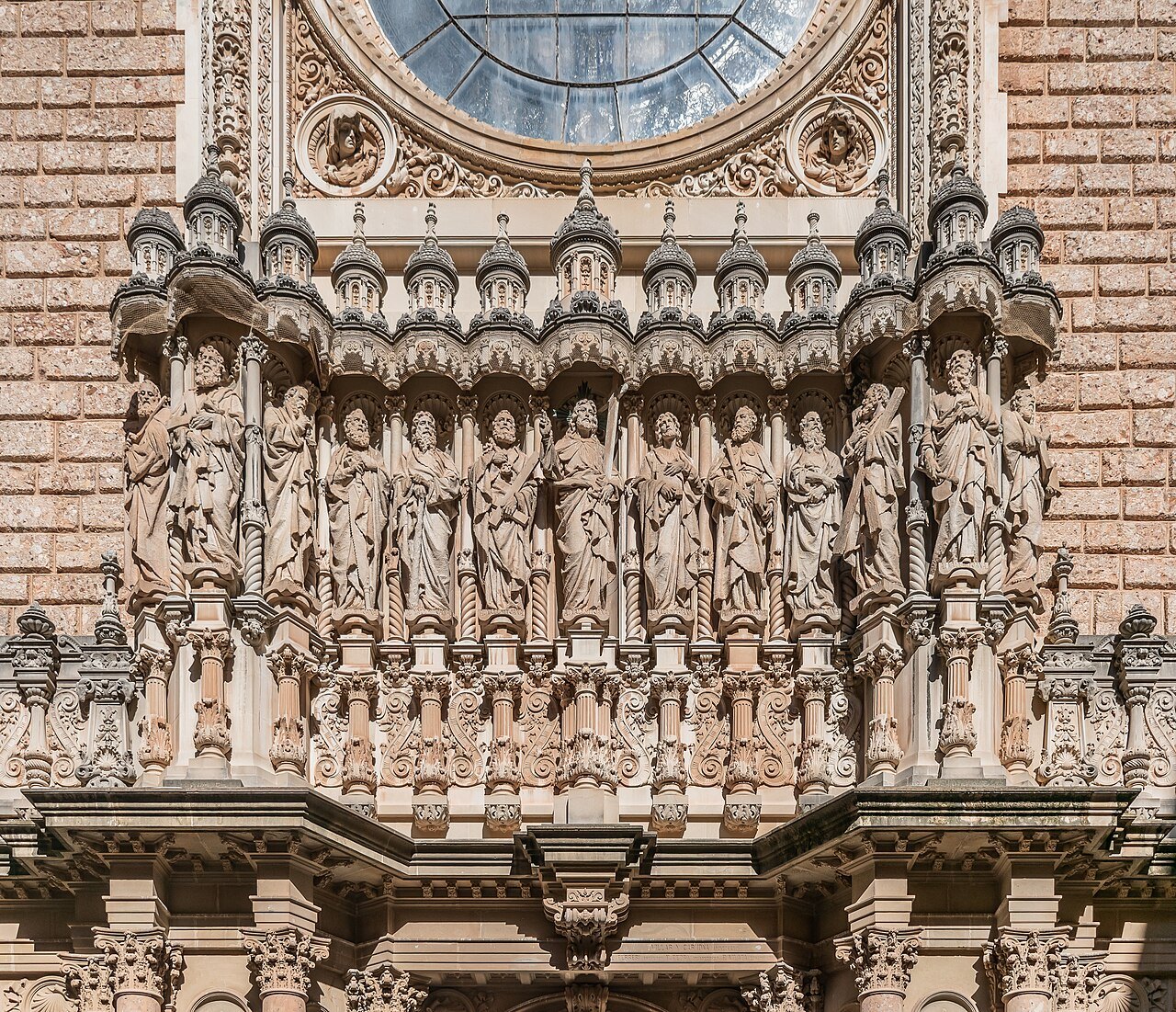 Carved figures across the upper façade of the basilica at Montserrat.