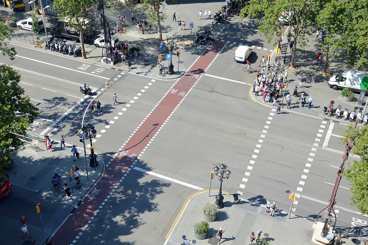 Why does the Eixample have chamfered corners?