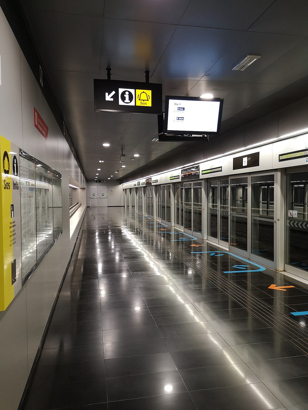 The platform at the airport's Terminal 2 metro station, behind glass doors.
