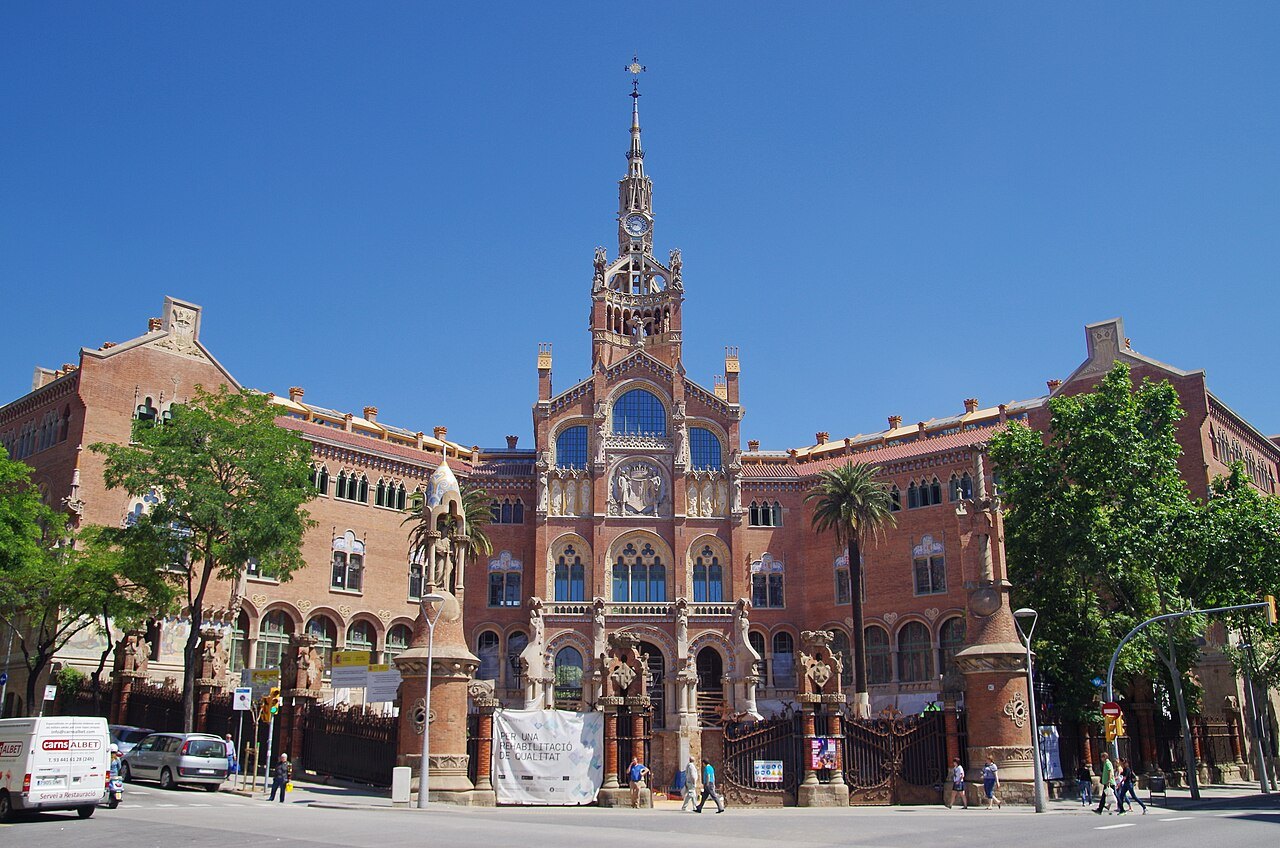 The administration building from across the avenue, with vans parked outside.
