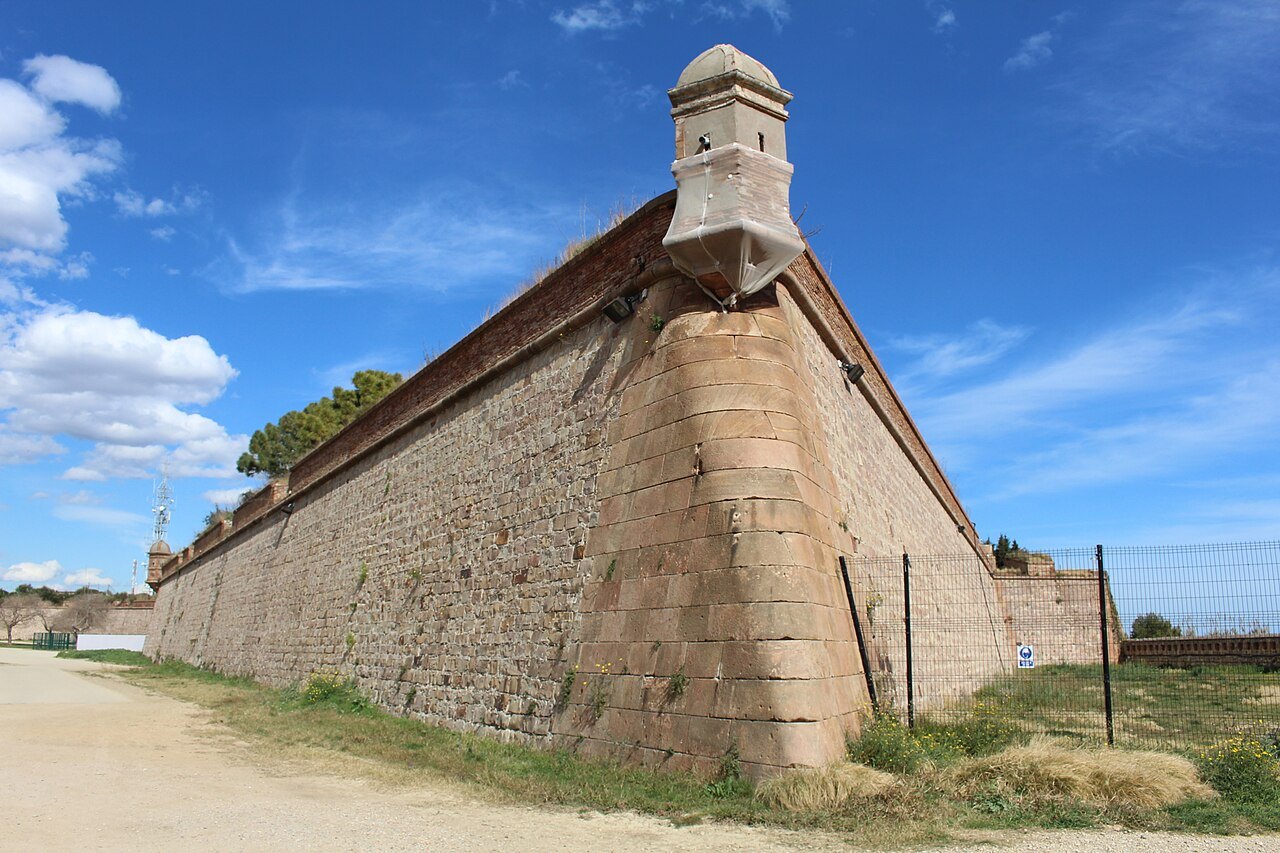 A corner bastion of the castle wall, with a small watchtower.