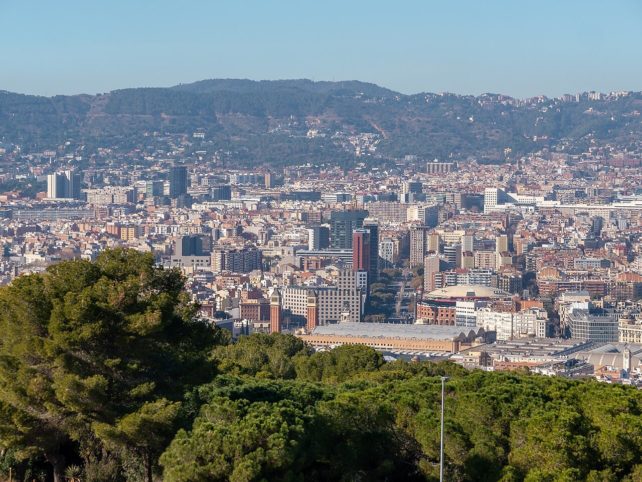 The city seen from the castle on Montjuïc, with the hills of Collserola behind.