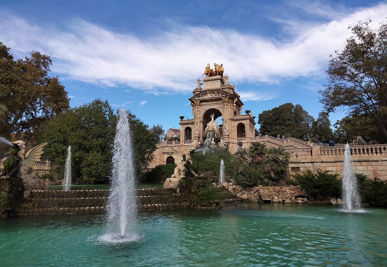 The Cascada, a monumental fountain with jets of water falling into a green pool.