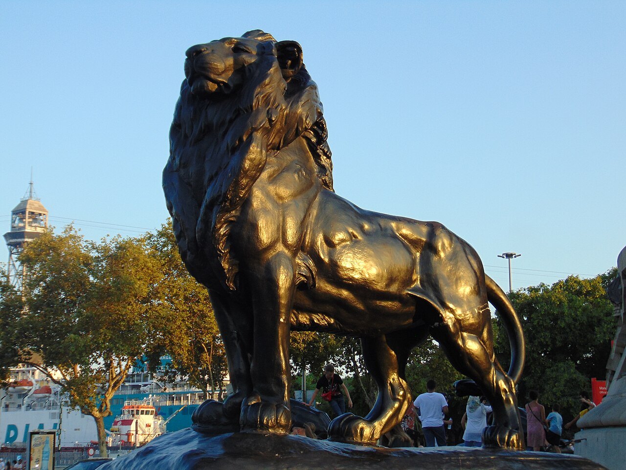A gilded lion at the foot of the Columbus Monument.