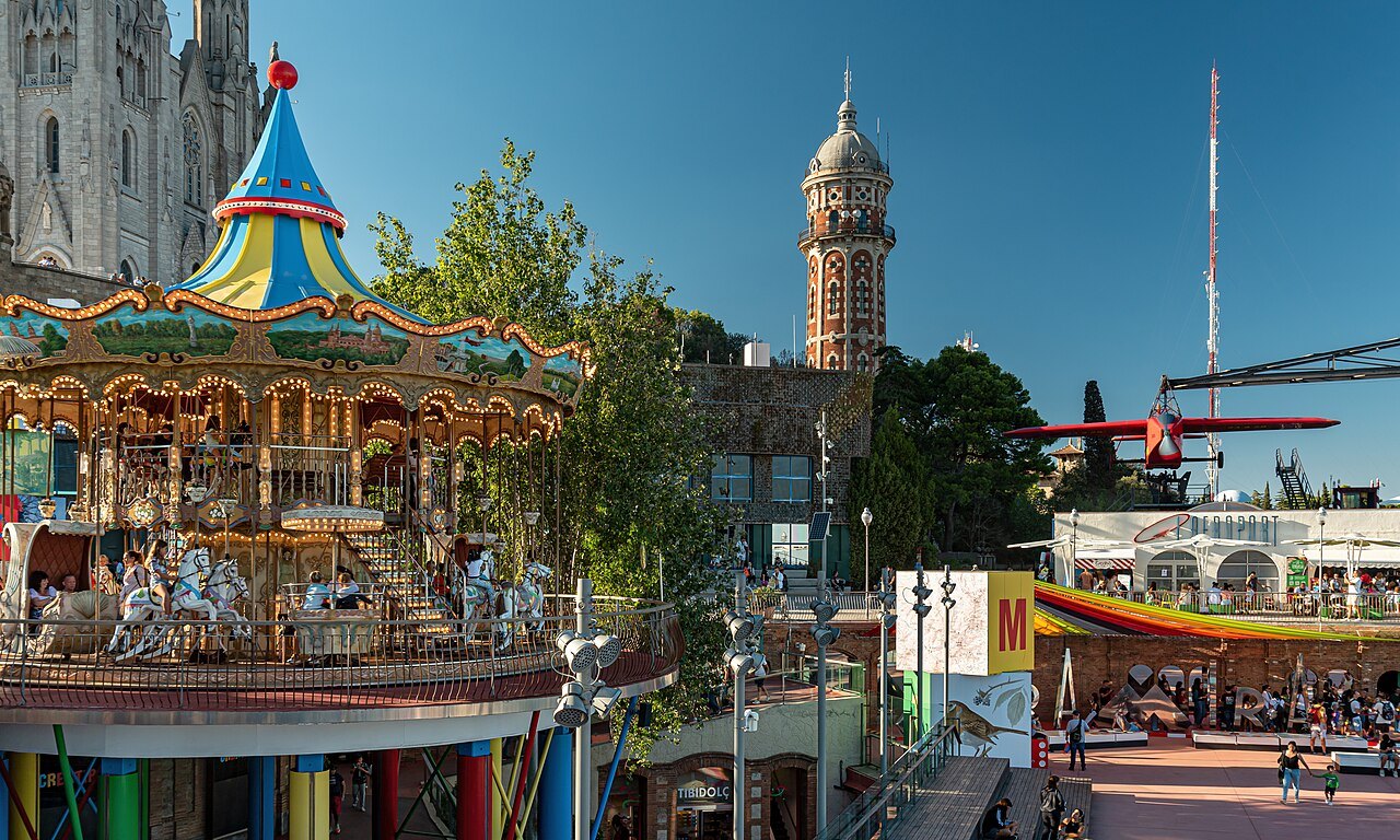A carousel at the Tibidabo amusement park, with the church behind.