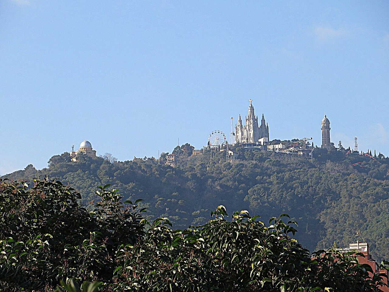 The church and the amusement park on the distant wooded summit of Tibidabo.