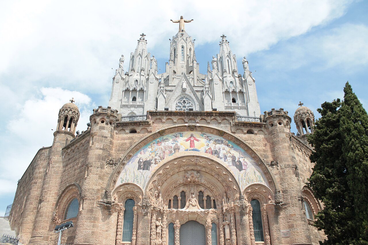 The front of the Sagrat Cor church on Tibidabo, its pale spires above a mosaic over the doorway.