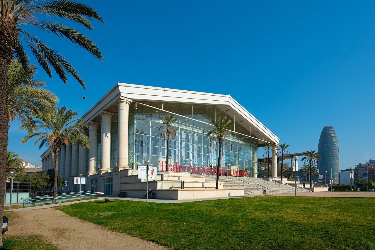 The columned entrance of the Teatre Nacional de Catalunya, with the Torre Glòries at right.